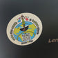 Ein Sticker auf dem ein QR Code ist mit Earthy, dem Maskottchen und dem Schriftzug "Make the earth a  better place".